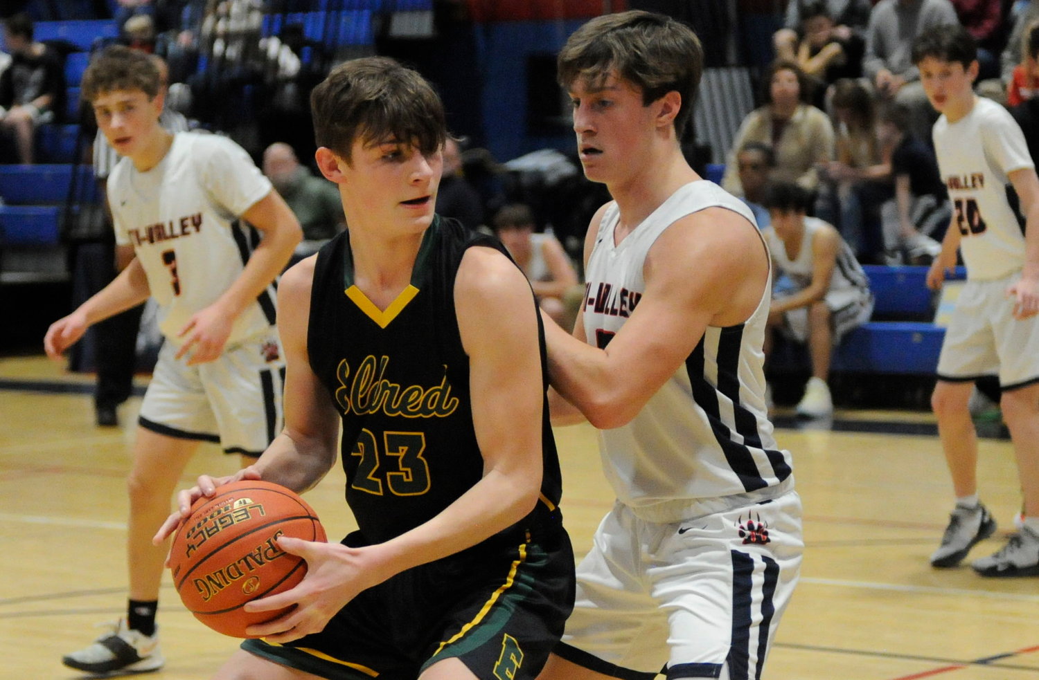 Close quarters. Eldred’s Sean Furler led his team with 12 points, He is pictured with Tri-Valley’s Zach Kitaychik.